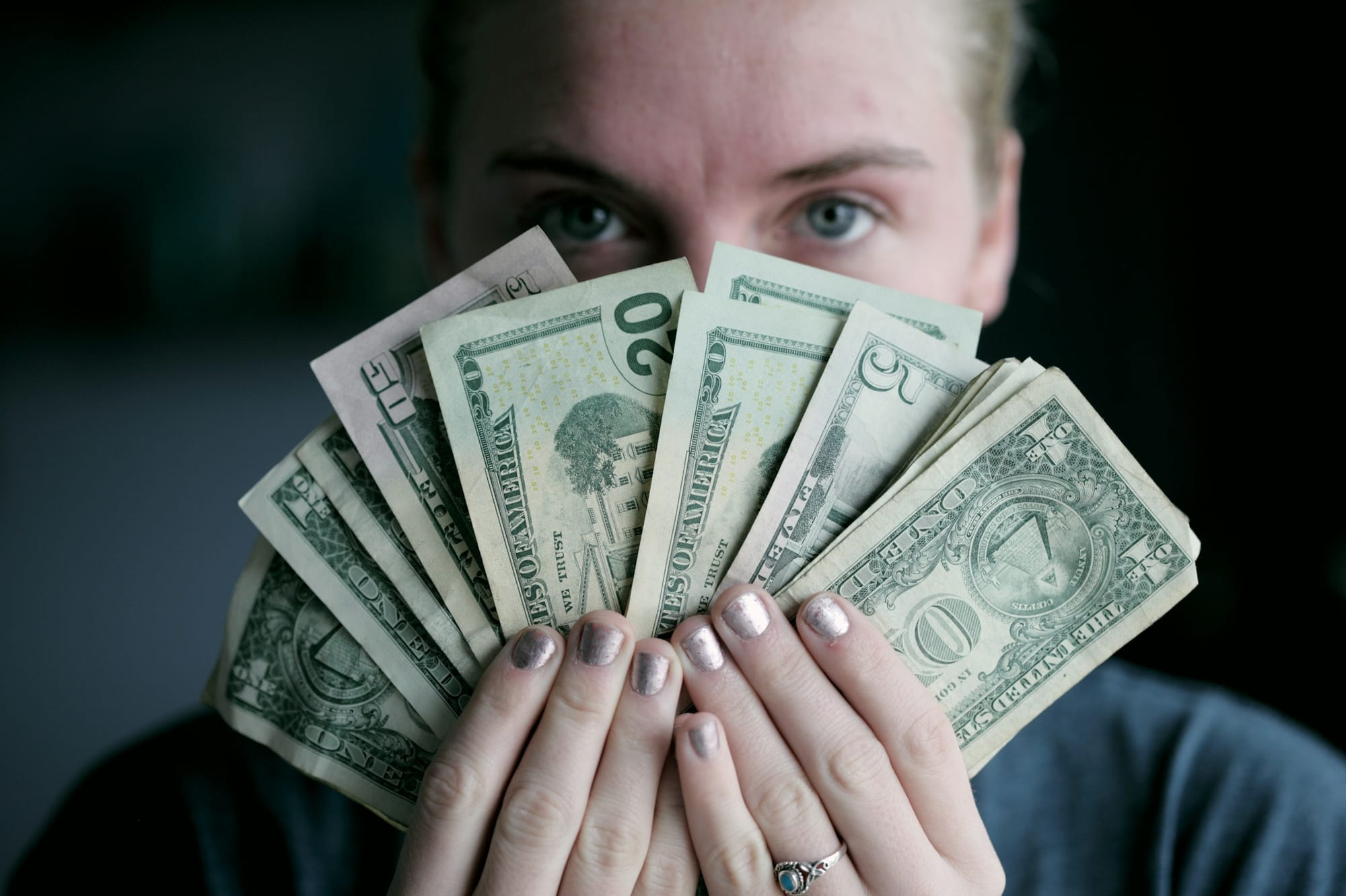 Man Holding Money - How Much Does Facebook Reels Pay Per 1,000 Views