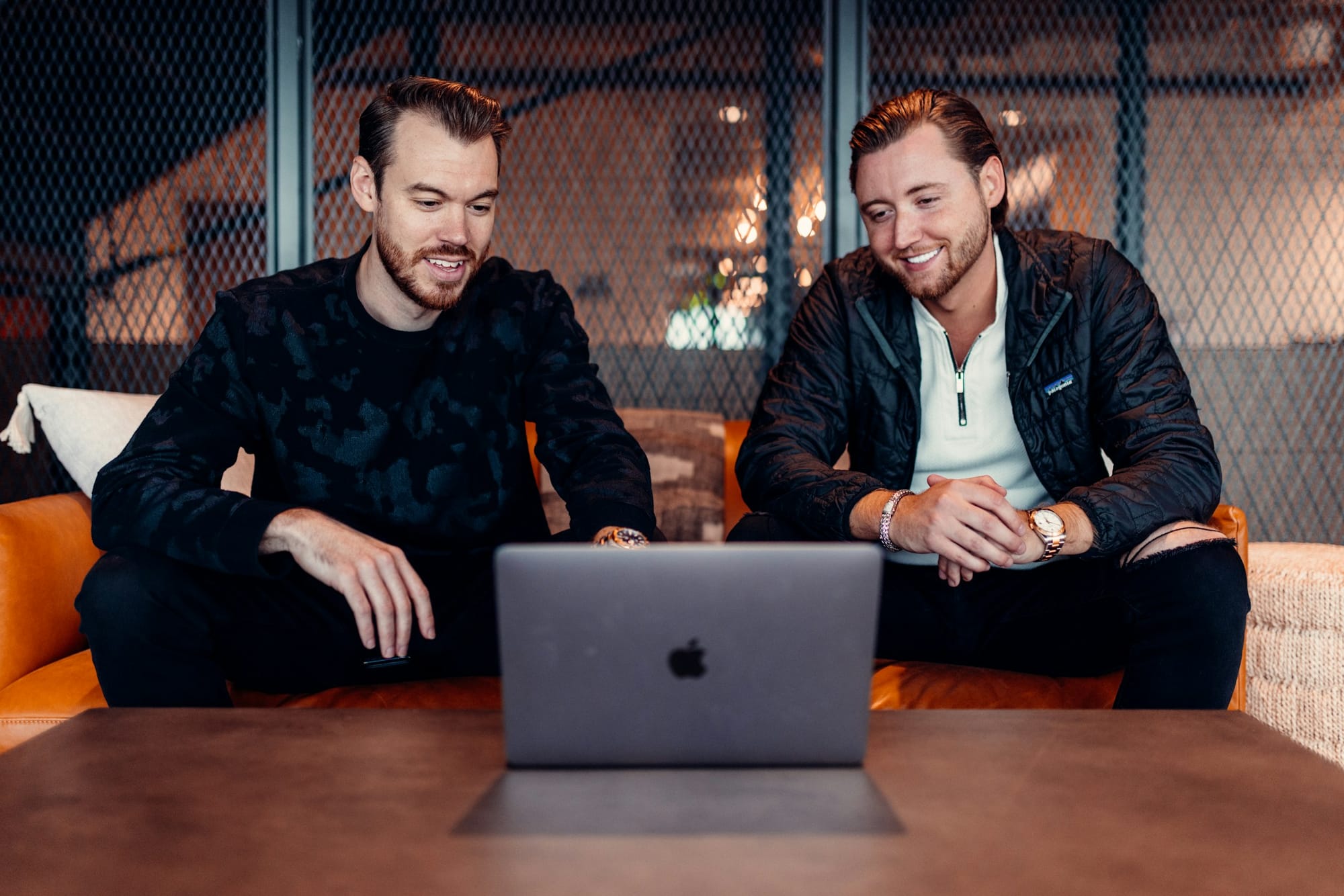 men on a macbook - YouTube Social Media Marketing