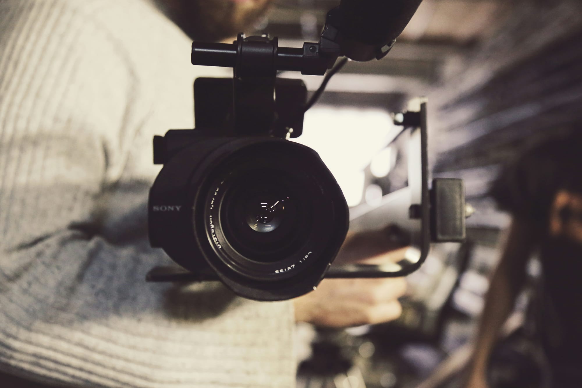 person with a camera - How To Add A Song To TikTok