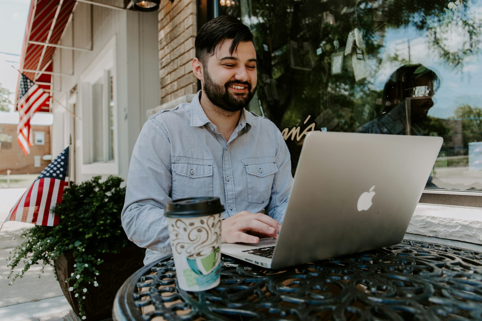 man working on laptop - How to Create Faceless Videos with AI