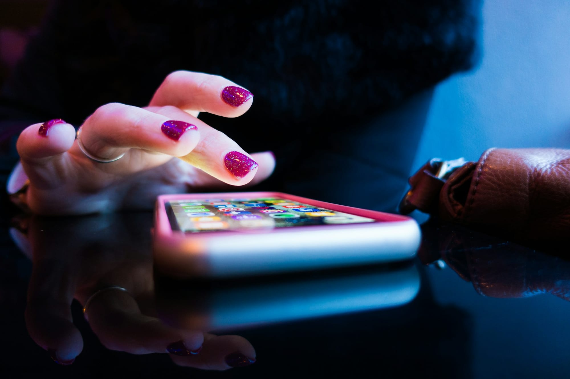 woman scrolling through her phone - Social Media Video Apps