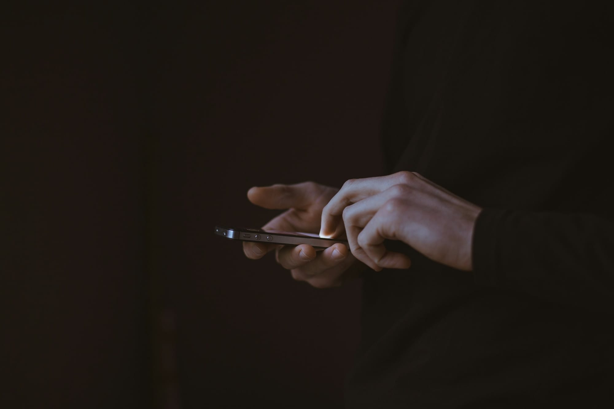 Man Holding Phone - How To Get More Story Views On Instagram