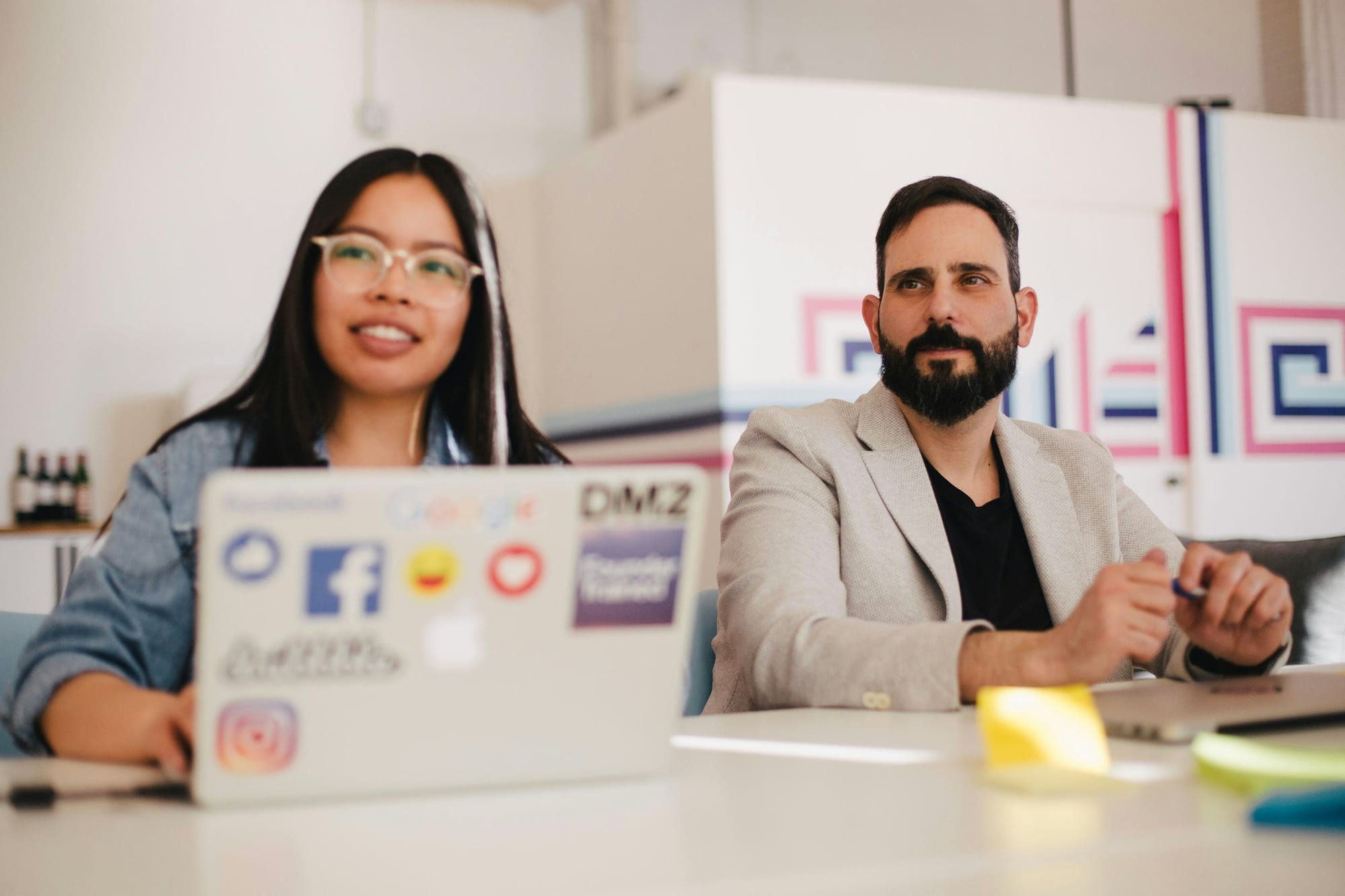 employees in a meeting - Social Media Video Marketing Tips