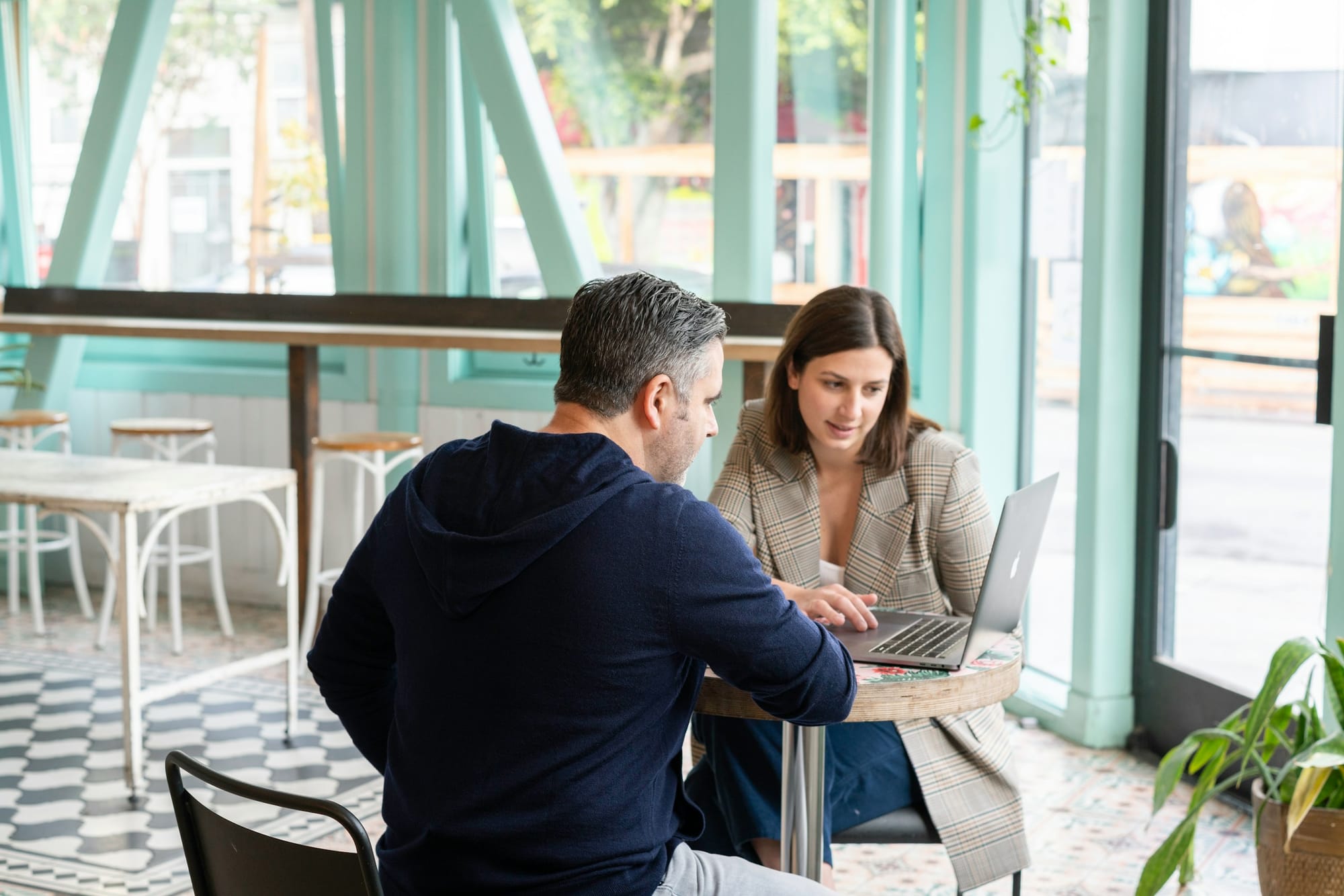 woman pitching ideas to boss - How To Make a LinkedIn Post Go Viral