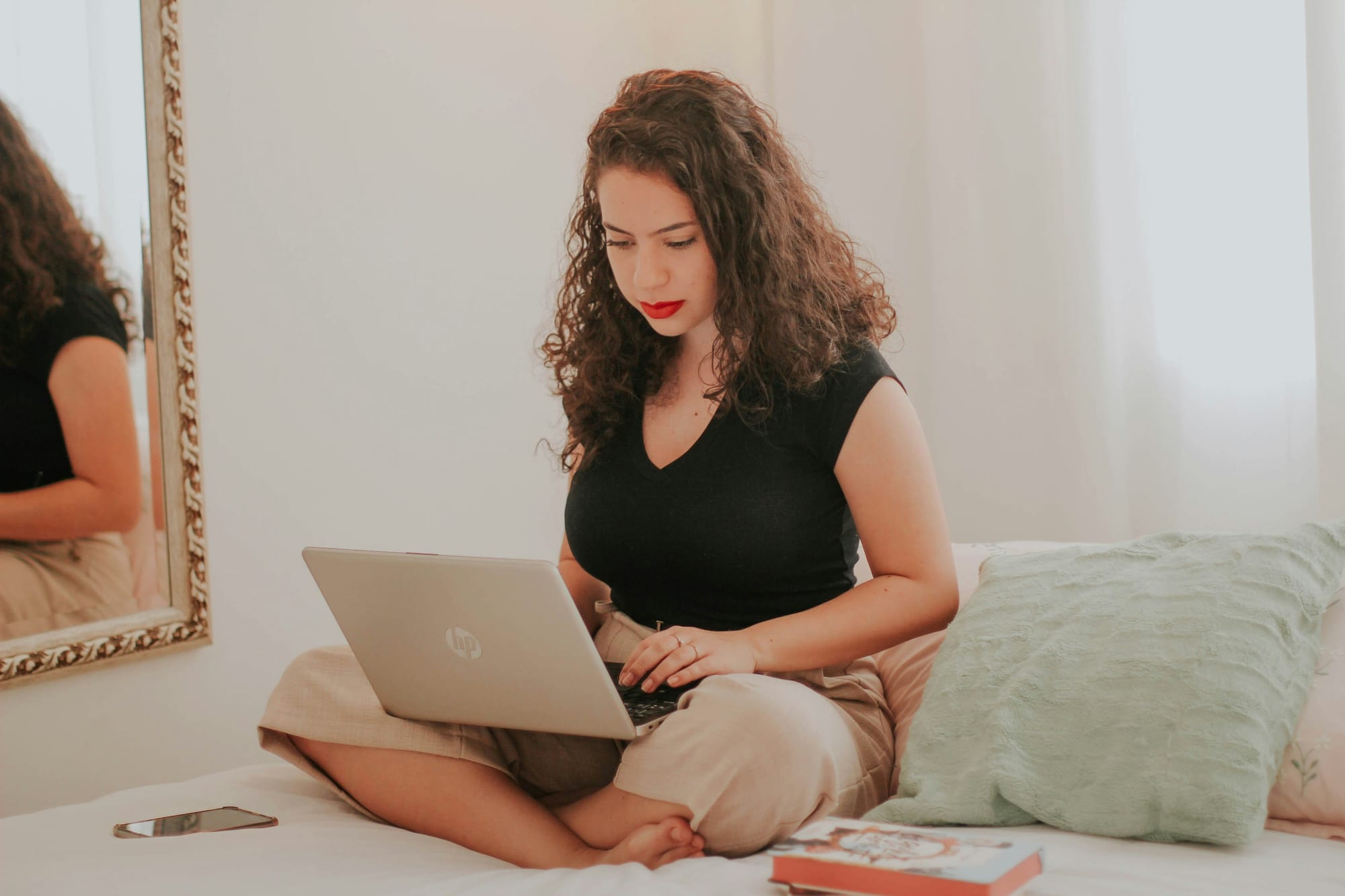 woman on a laptop - Best Video Format for Social Media