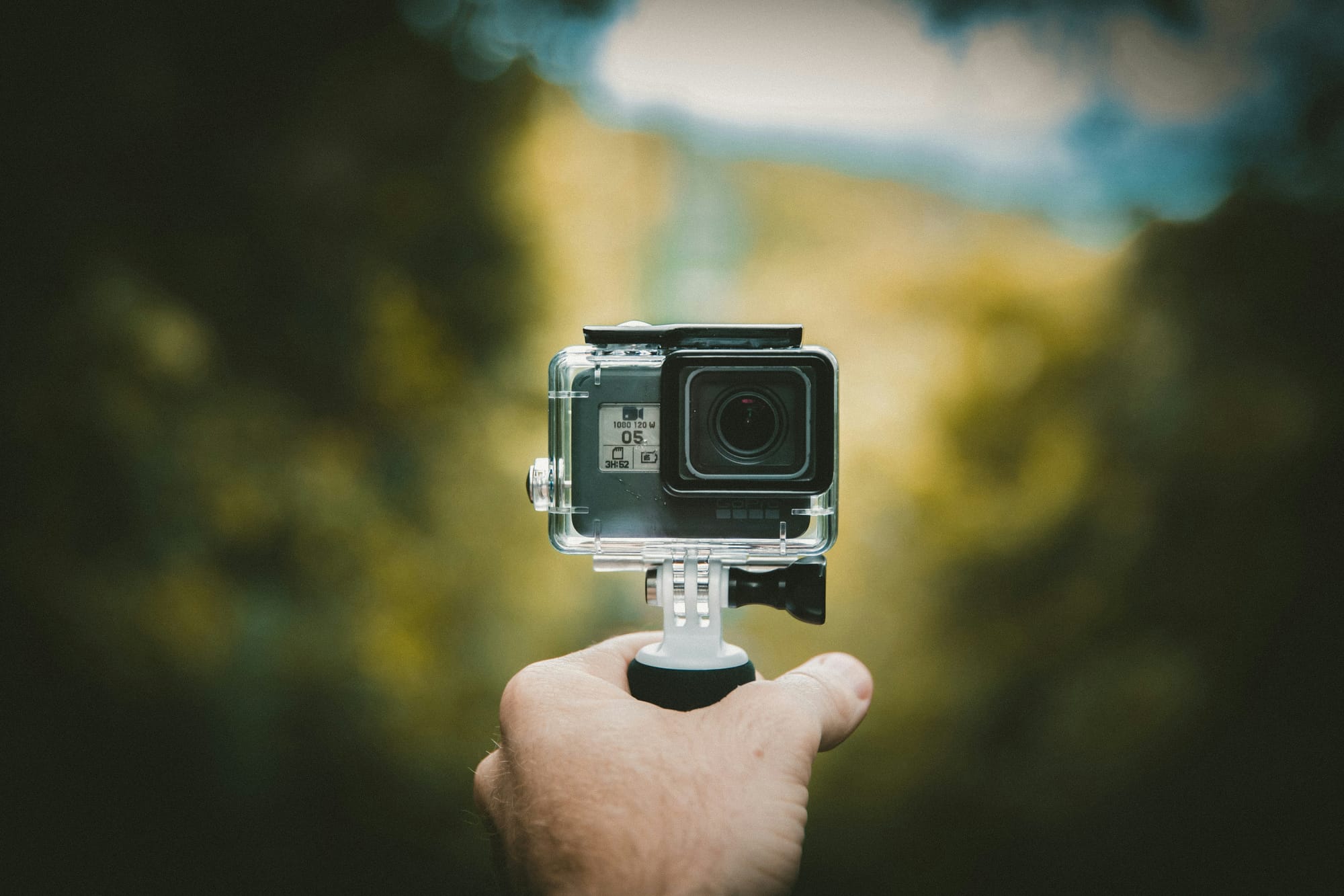 person with a small gopro - How To Add Your Own Music To TikTok