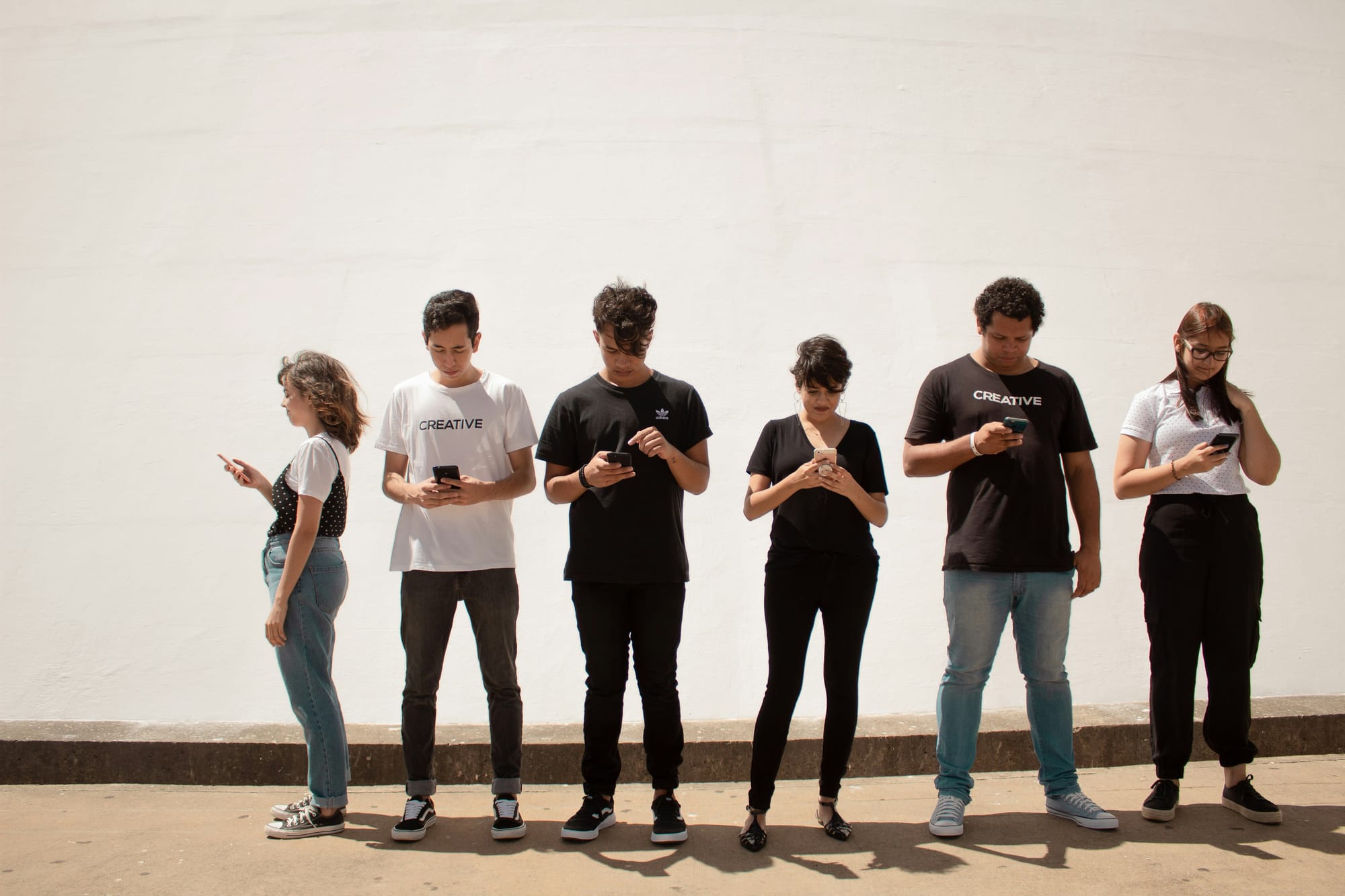 people in a line choosing between Tiktok Vs Youtube Shorts