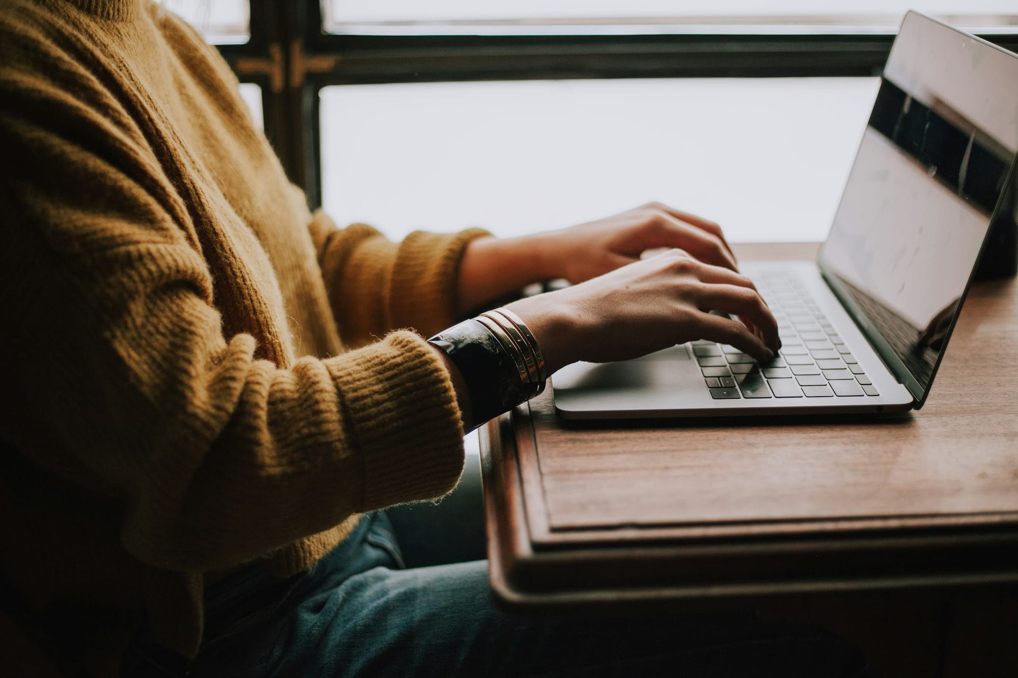 person working on laptop - Faceless Content Creation