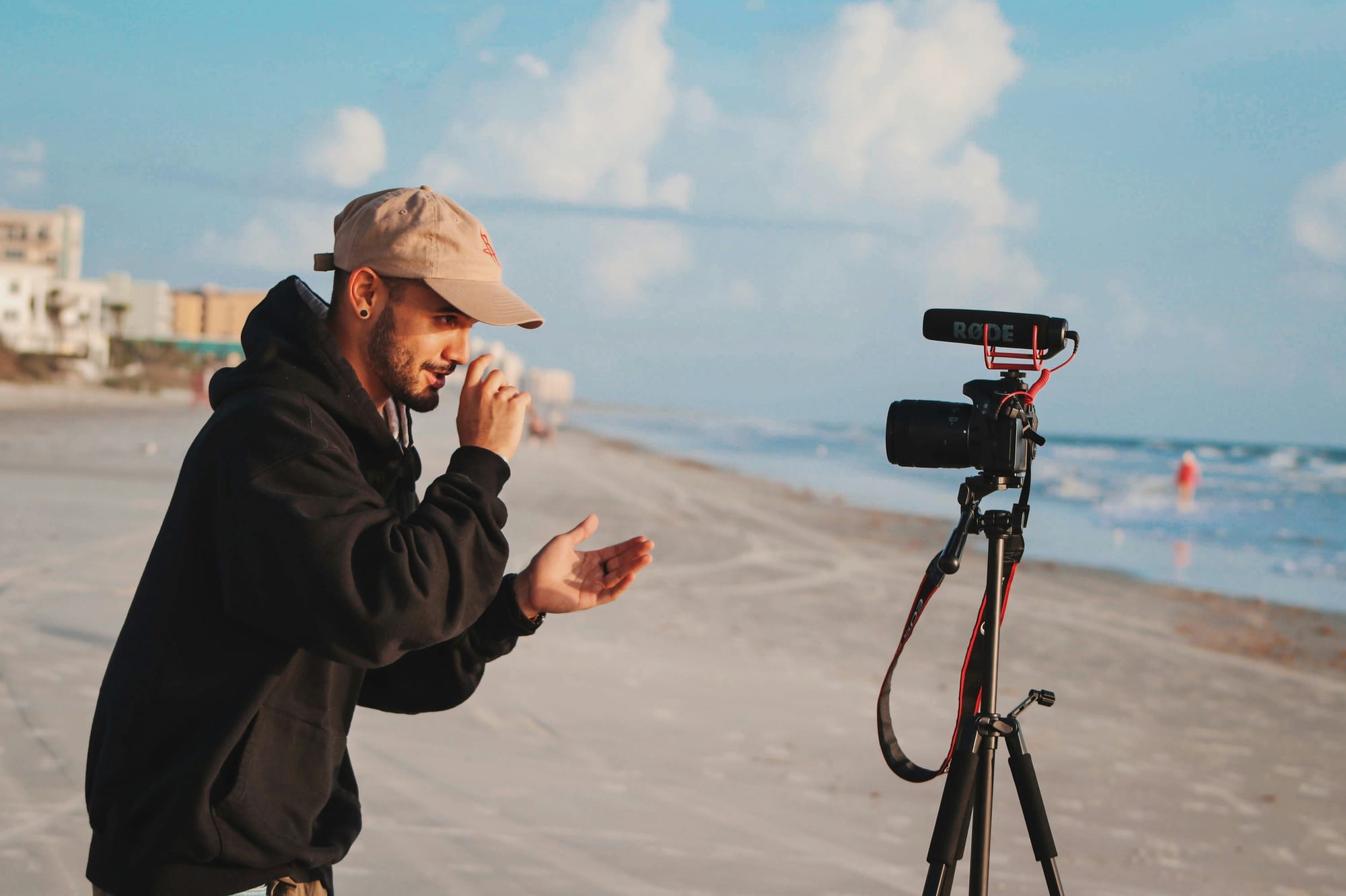 person on beach recording - How To Make Videos On Tiktok