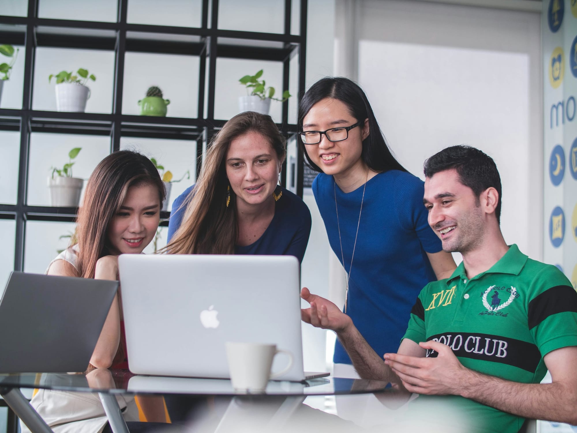 employees on a laptop - Why Is Marketing YouTube Videos Crucial for Brands