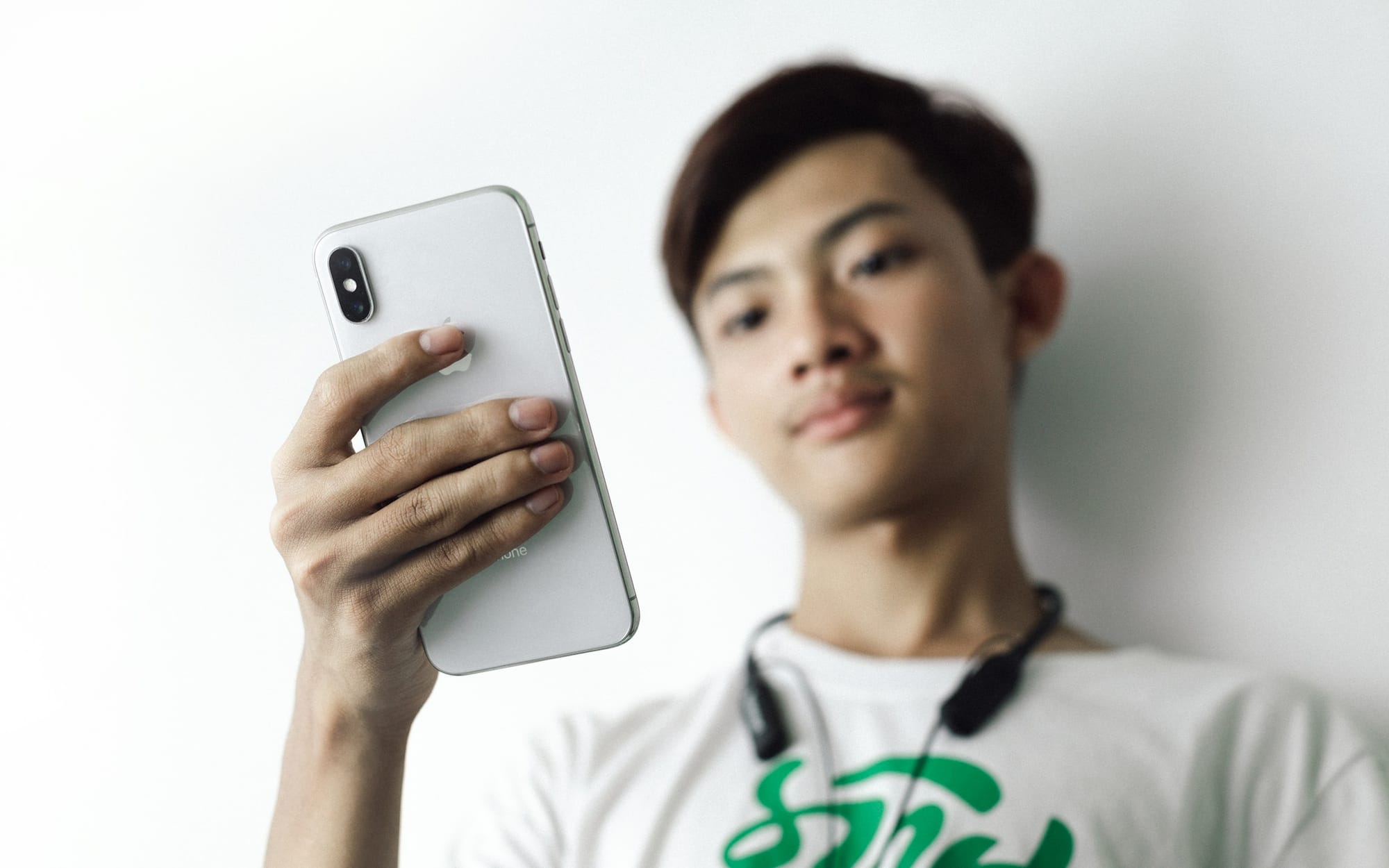 person focused on mobile - How To Start a Trend on TikTok