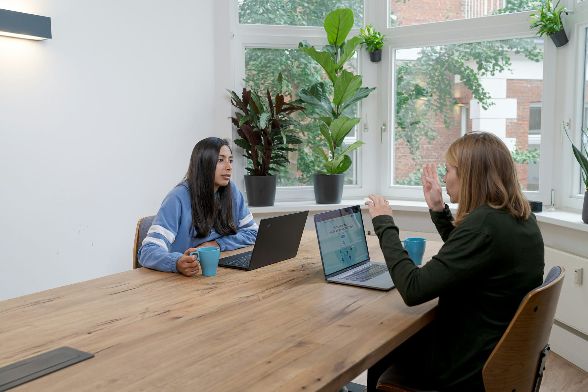 person in a meeting - What Makes Online Content Go Viral