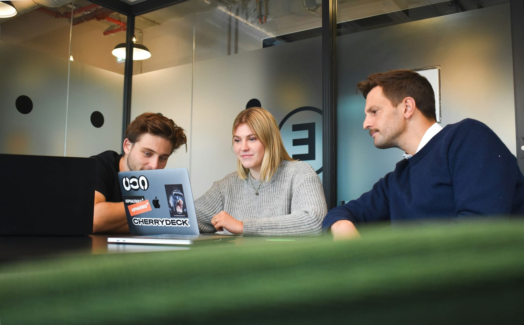 team on laptop - Faceless Content Creation