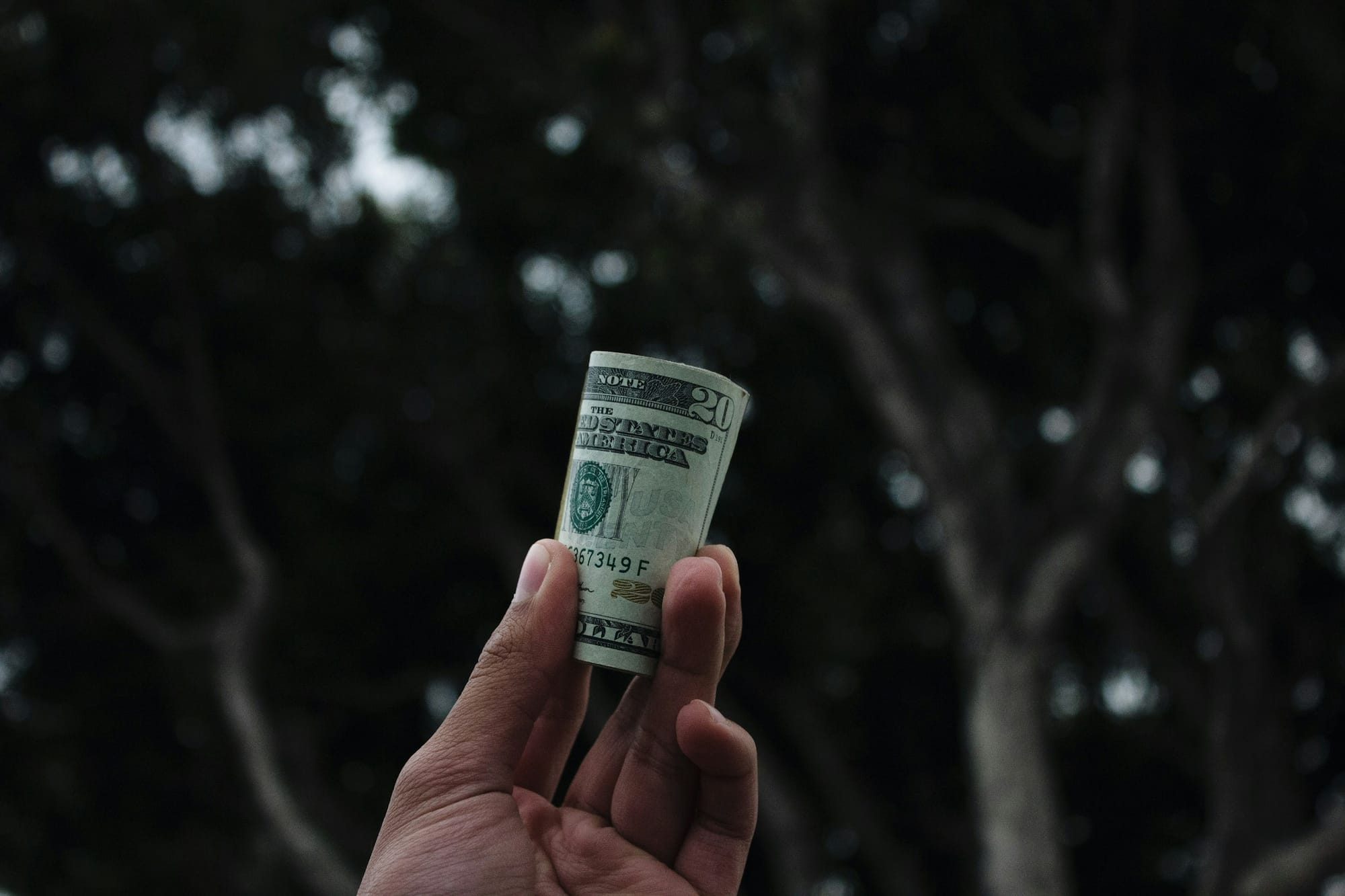 man holding money - Video Content Creator