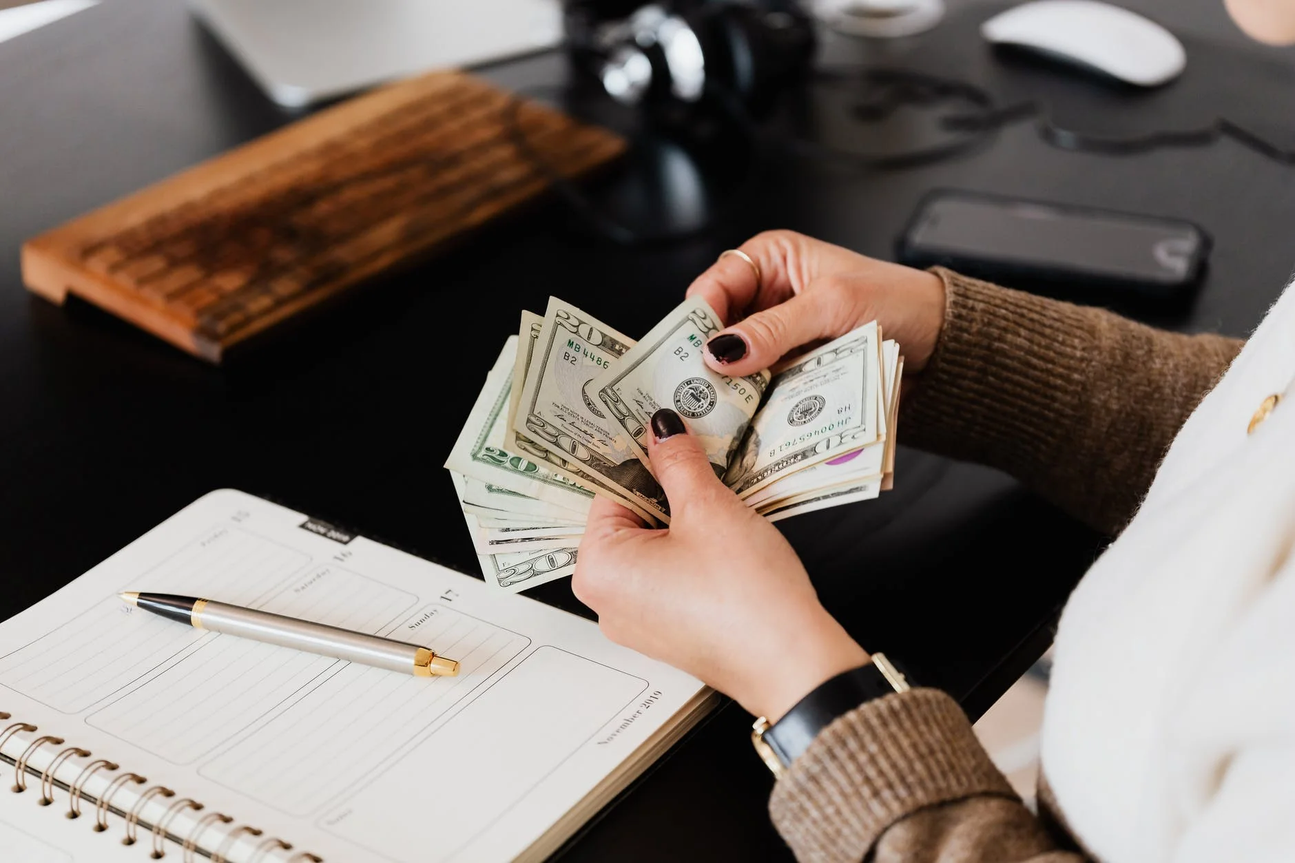 woman counting money - How To Get Paid On Twitter