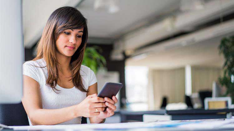 woman using a phone - How Do Reels Work on Facebook